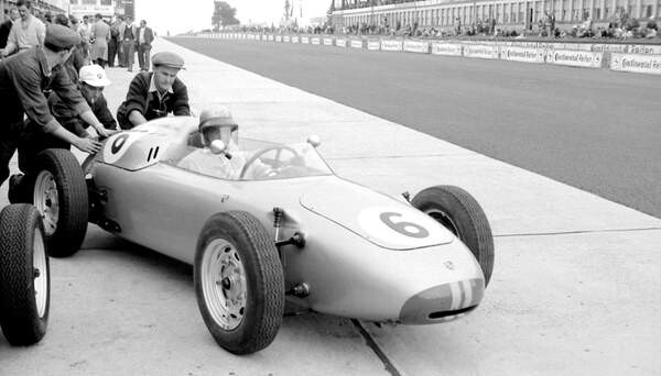 Klistermärke Hans Herrmann in a porsche being pushed out of the pits, 1960