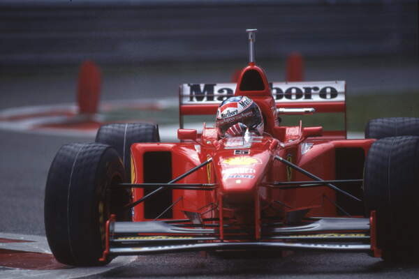 Fotografie Michael Schumacher in a Ferrari F310B at the Belgian GP, Spa Francorchamps, Belgium, 1997, 40x26.7 cm