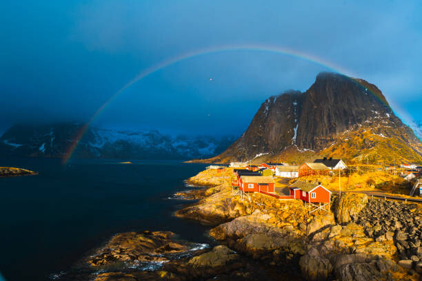 Fotografie Rainbow over Reine, Lofoten Islands, Norway, © Marco Bottigelli, 40 × 26.7 cm