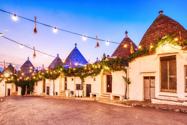 Fotografie Famous Trulli Houses in Alberobello Illuminated, roman_slavik, 40x26.7 cm