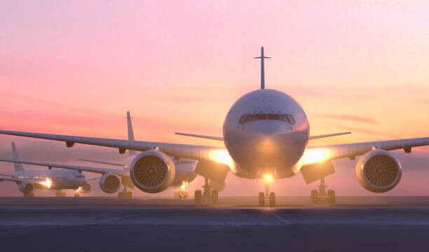 Ilustrace Airplanes taxiing on runway at sunset, Colin Anderson Productions pty ltd, 40 × 24.6 cm