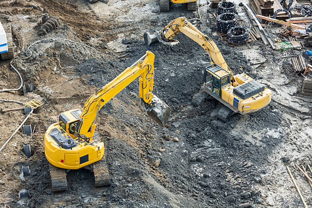 Levně Plakát, Obraz - Aerial view of diggers at construction site, Don Mason, 40 × 26.7 cm