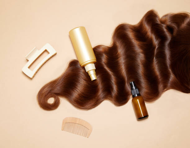 Levně Plakát, Obraz - Photo of female brunette hair, hairclip,, Anton Vierietin, 40 × 30 cm