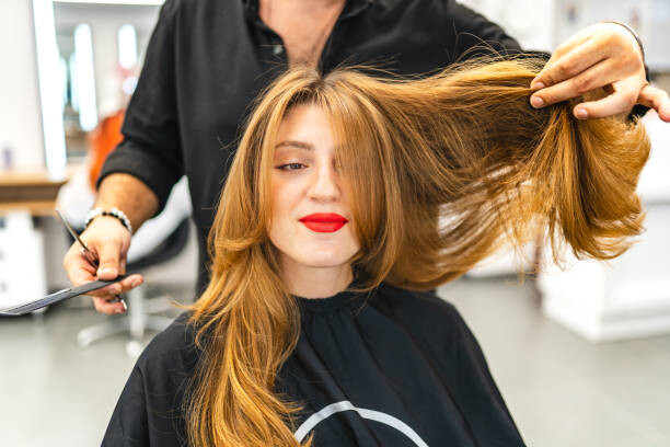Levně Plakát, Obraz - Beautiful young woman getting her hair cut, Su Arslanoglu, 40 × 26.7 cm