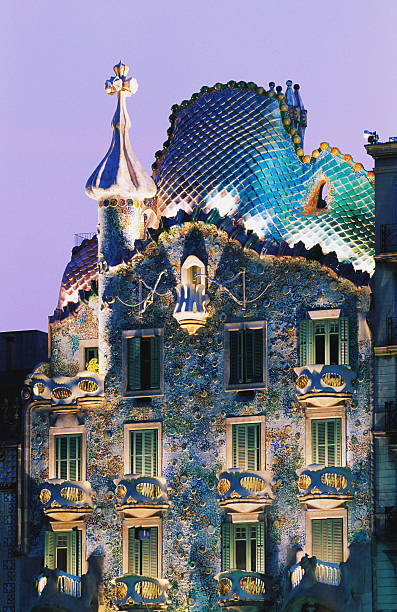 Levně Plakát, Obraz - Spain, Barcelona, Gaudi's Casa Batllo, dusk, Shaun Egan, 26.7 × 40 cm