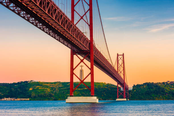 Levně Plakát, Obraz - 25th of April Bridge Lisbon Portugal at Sunset, © Allard Schager, 40 × 26.7 cm