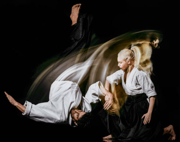 Poster Aikido budokas man and woman isolated