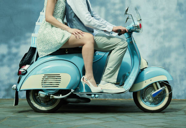 Poster Couple riding vintage scooter