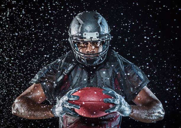 Poster Water splashing on Black football player
