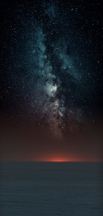 Photographie d'art Astrophotography picture of sunset sea landscape with milky way on the night sky.