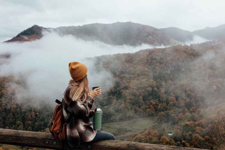 Photographie d'art Woman having breakfast in the mountains in autumn