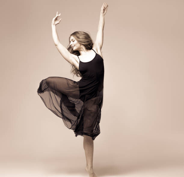 Umetniška fotografija Ballet dancer woman black dress. Studio shot.