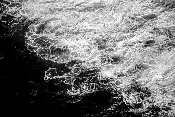 Umělecká fotografie Black and white rough surf sea