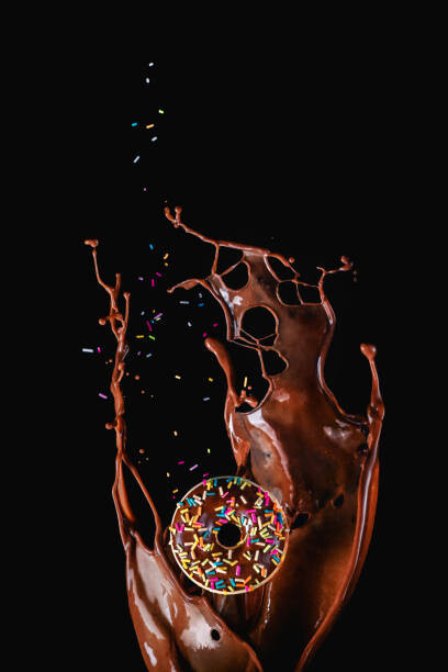 Kunstfotografie Chocolate splash and a donut with