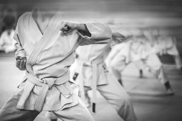 Fotografi Elbow punch in karate. Children's training.