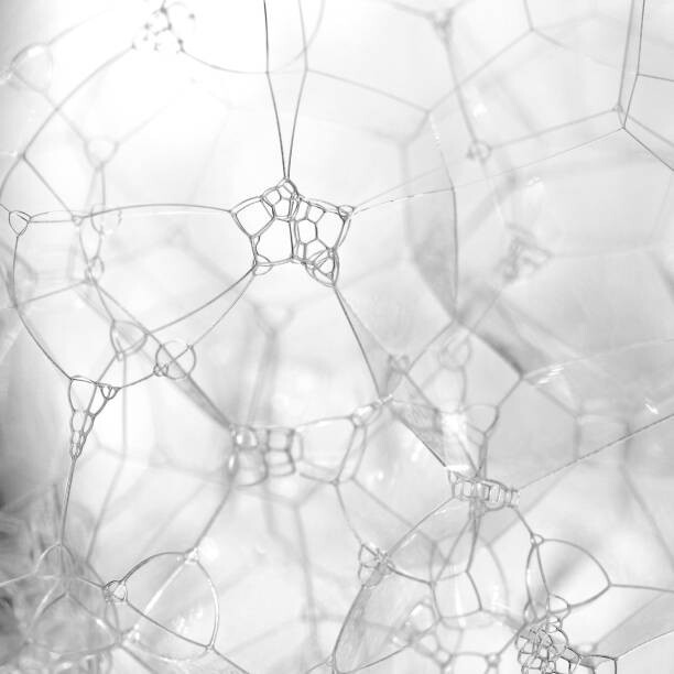 Fotografia artystyczna Extreme close up of bubbles in black and white