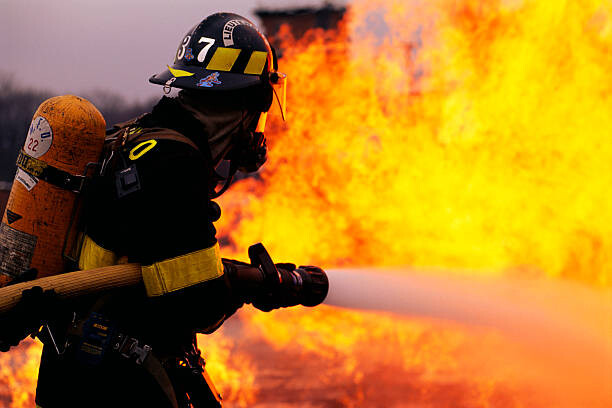 Photographie artistique Firefighter Battling Flame