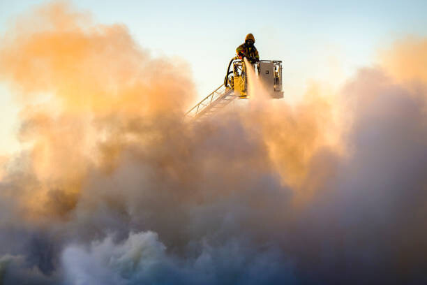 Umělecká fotografie Firefighter fighting fire