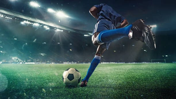 Umetniška fotografija Football or soccer player in action