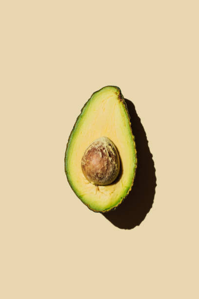Umetniška fotografija Fresh ripe green avocado fruit halves