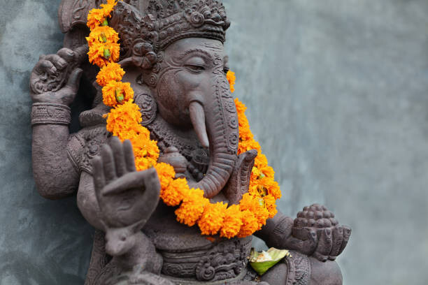 Umělecká fotografie Ganesha with balinese Barong masks, flowers