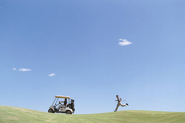Umjetnička fotografija Golfer Chasing Golf Cart