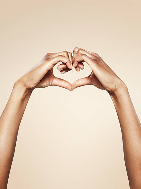 Photographie artistique Hands forming a cute heart shape