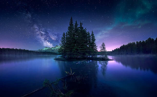 Художествена фотография Milky way and Aurora Borealis at Two Jack Lake