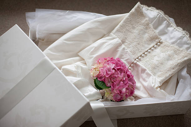 Umelecká fotografie Pink hydrangea on wedding dress  in box