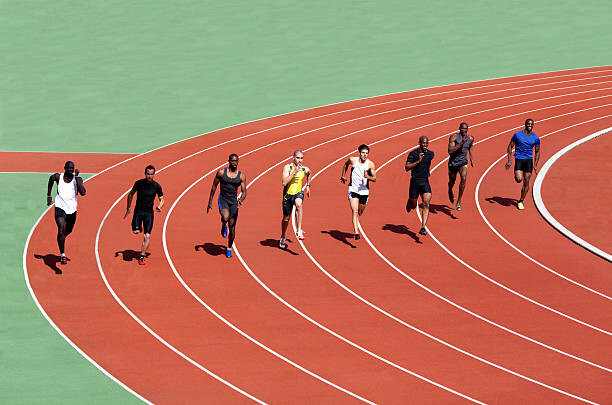 Konstfotografering Runners racing on track