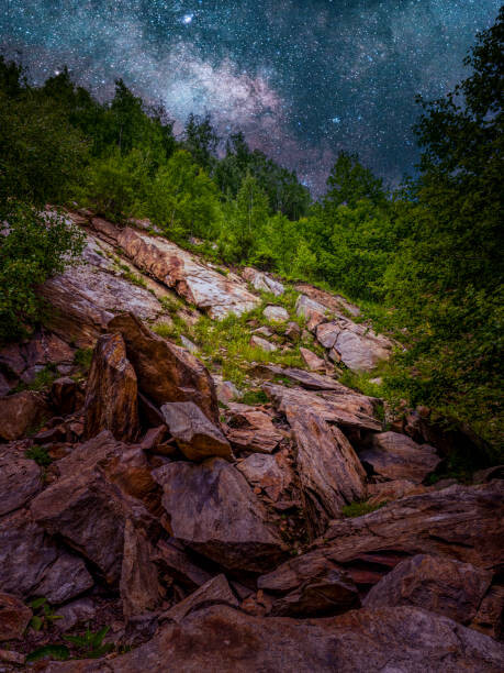 Fotografia artystyczna Scenic view of rocks against sky at night,Romania
