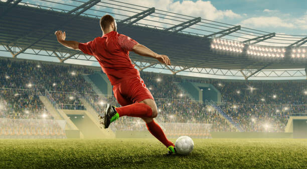 Художествена фотография Soccer player kicks a ball