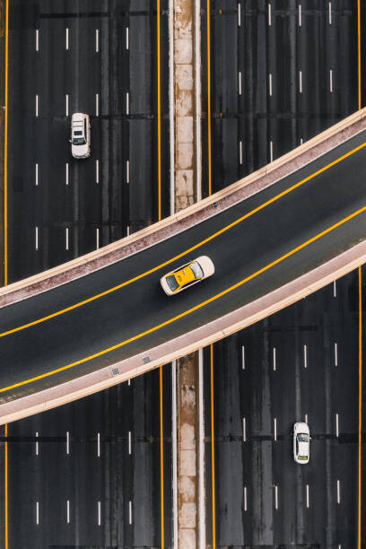 Fotografía artística Taxi on an overpass crossing above