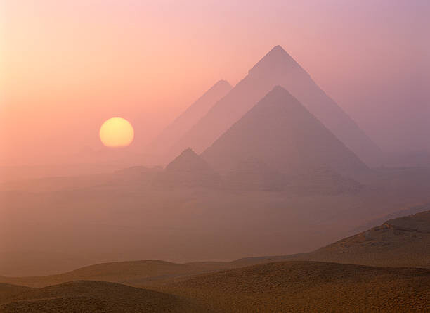 Художествена фотография The Pyramids viewed at sunrise, Giza, Egypt