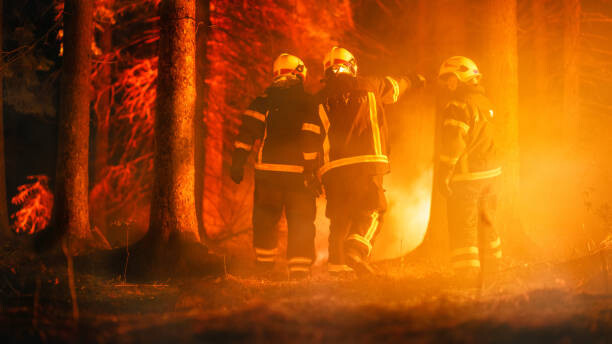 Photographie artistique Three Volunteer Firefighters with Safety Equipment