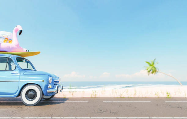 Fotografia Vintage car with beach accessories on