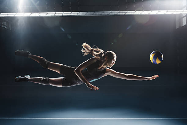 Umělecká fotografie Volleyball player jumping to the ball