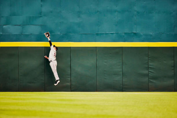 Художествена фотография Wide shot baseball player jumping for