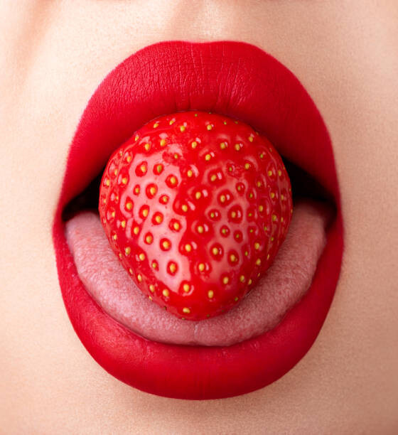 Photography Woman mouth extreme close-up. Strawberry on