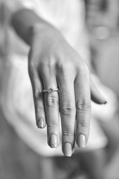Umelecká fotografie Women hand with diamond ring. Wedding accessories