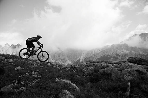 Print op canvas Italy, Tyrol, senior biker riding on