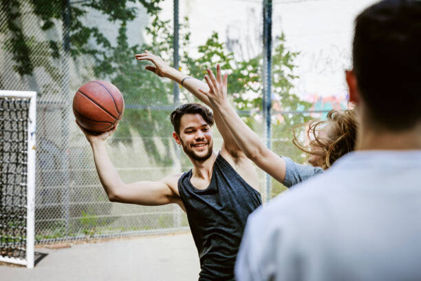 Schilderij op canvas Basketball Players Competing For Control Of