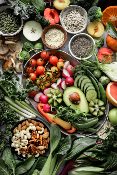 Obraz na plátne Fresh vegetables with mixed nuts flat