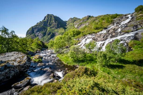 Schilderij op canvas Lofoten waterfall on the hiking trail