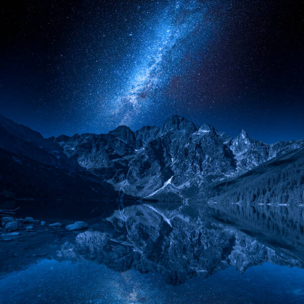 Fototapete Milky way and lake in the