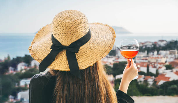 Fototapeta A woman in a wicker hat