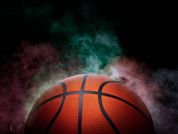 Fototapeta basketball on the color smoke background