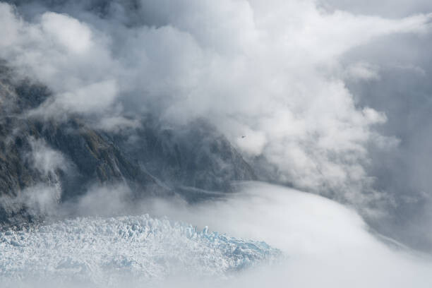 Fototapeta Hiking the glacier high up in the alps