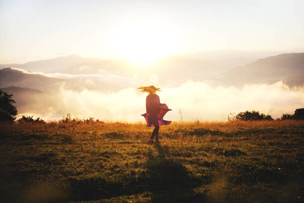 Fototapeta Pretty Young Girl Dancing in Mountains