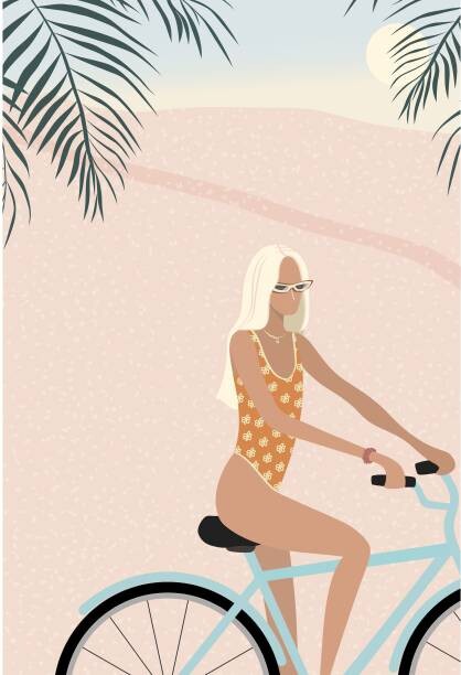 Fototapeta Surfer girl in bikini on bicycle